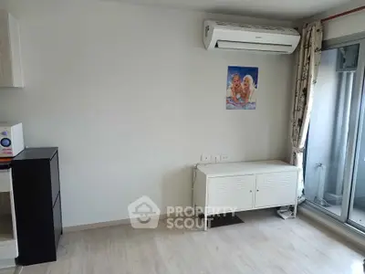 Modern minimalist living room with air conditioning and balcony access