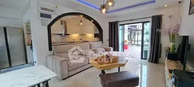Modern open-plan living room with stylish kitchen and balcony access