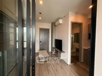 Modern apartment interior with sleek design, featuring a cozy living area and stylish bathroom.