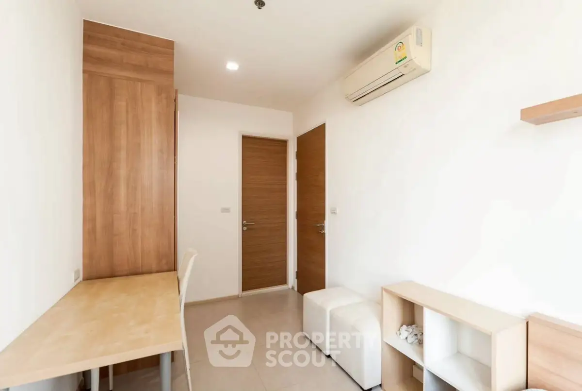 Minimalist study room with wooden accents and air conditioning