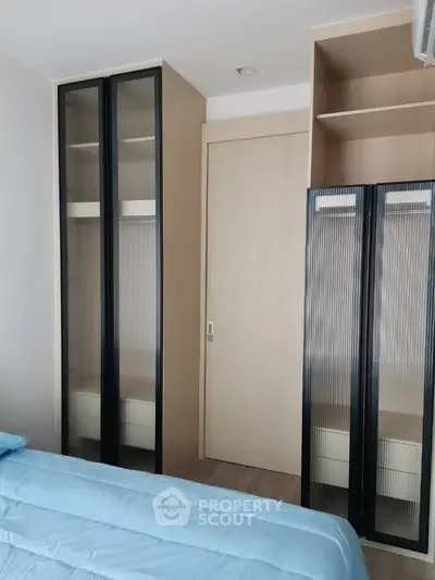 Modern bedroom with sleek storage solutions and minimalist design