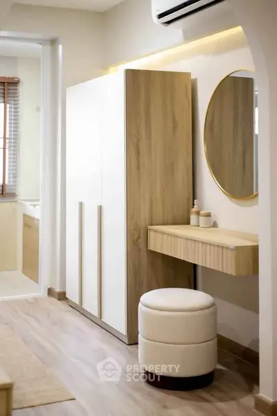 Modern bedroom with stylish vanity and elegant decor