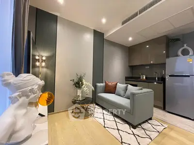Modern living room with stylish decor and compact kitchen area