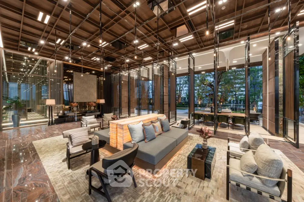 Luxurious modern living room with elegant decor and expansive glass walls overlooking greenery.