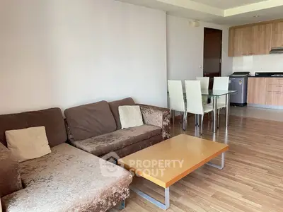 Spacious living room with modern kitchen in open layout apartment