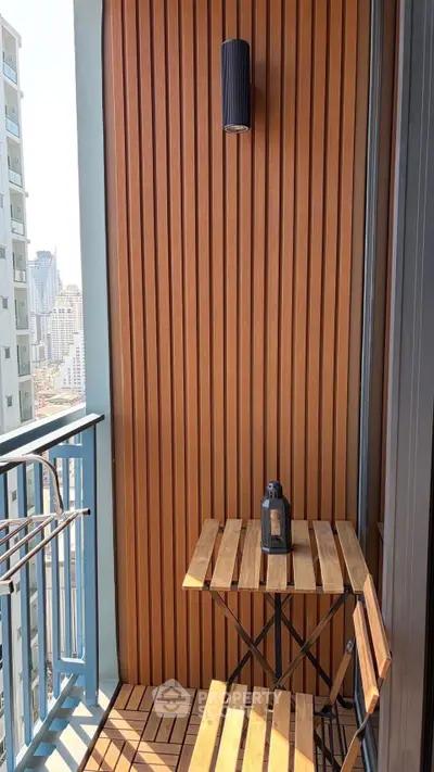 Charming urban balcony with wooden decor and city view, perfect for relaxation.