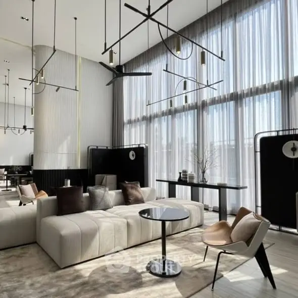 Luxurious modern living room with high ceilings and elegant decor