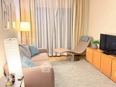 Cozy living room with modern furniture and soft lighting, perfect for relaxation.