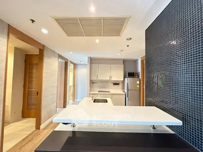 Modern kitchen with sleek design and open layout, featuring stainless steel appliances and stylish backsplash.