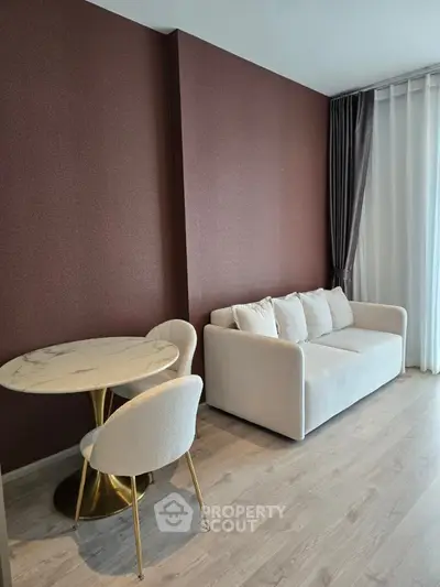 Modern living room with elegant sofa and stylish dining set