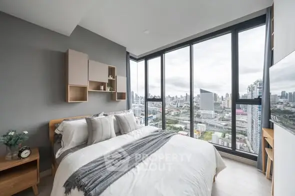 Modern bedroom with stunning city view and stylish decor