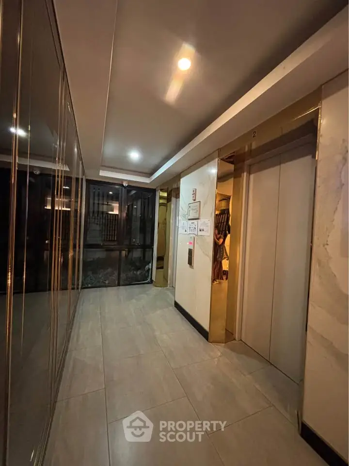 Modern building elevator lobby with sleek design and ambient lighting
