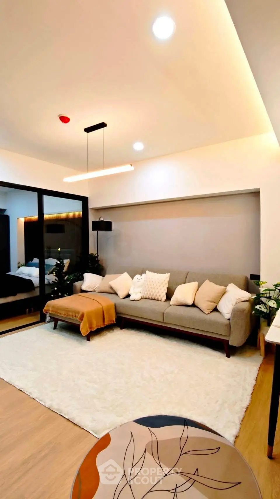 Modern living room with cozy sofa and stylish decor in a contemporary apartment.