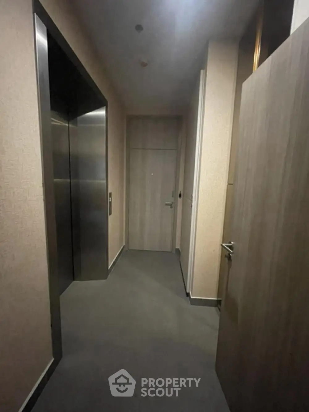 Modern elevator hallway with sleek design and neutral tones