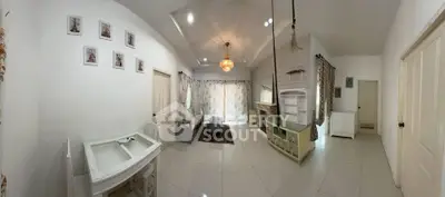 Spacious living room with elegant decor and ample natural light