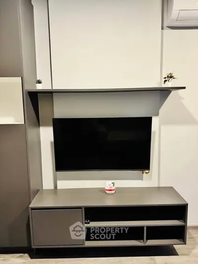 Modern living room with sleek TV unit and minimalist decor