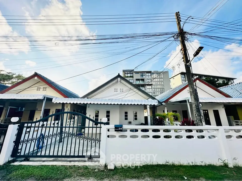 Charming single-story homes with gated entrance and modern design in a serene neighborhood.