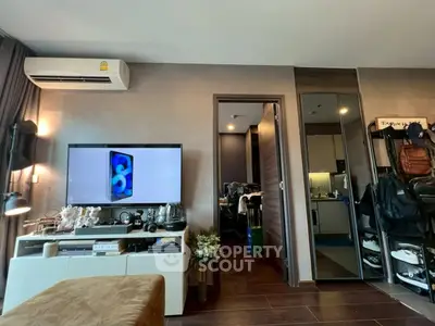 Modern living room with stylish decor and wall-mounted TV