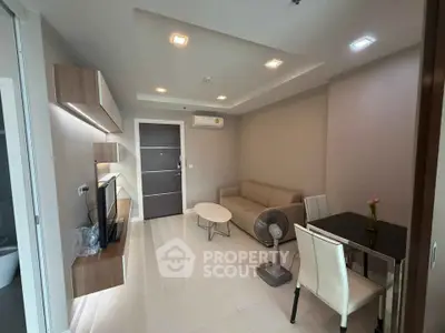 Modern living room with sleek furniture and ambient lighting in a stylish apartment.