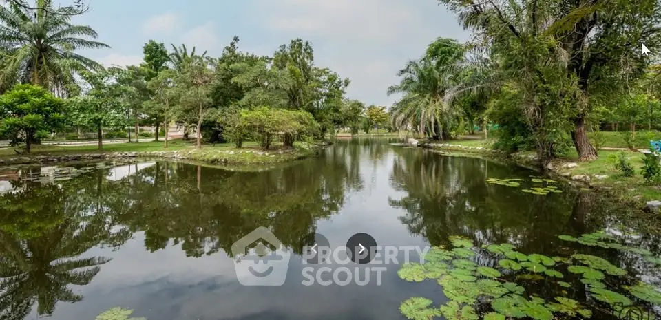 Serene garden view with tranquil pond and lush greenery, perfect for nature lovers.