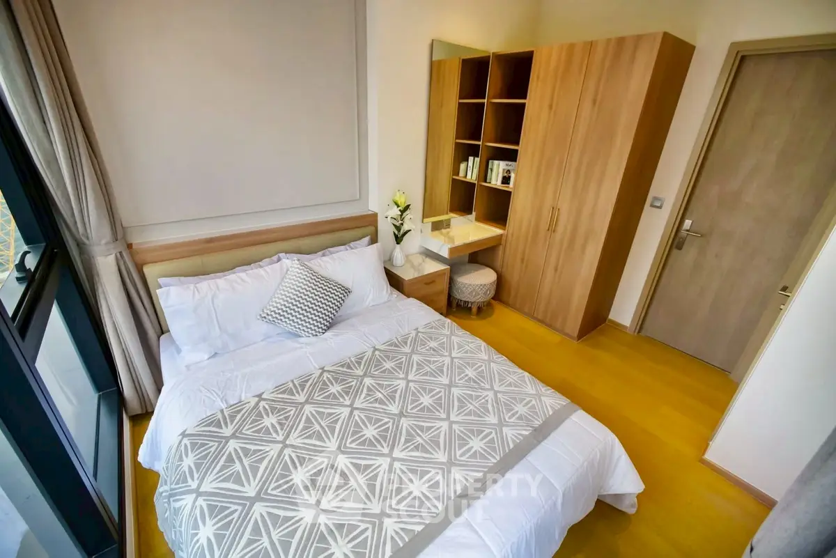 Modern bedroom with stylish decor and ample natural light