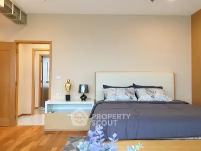 Spacious bedroom with modern decor and cozy ambiance