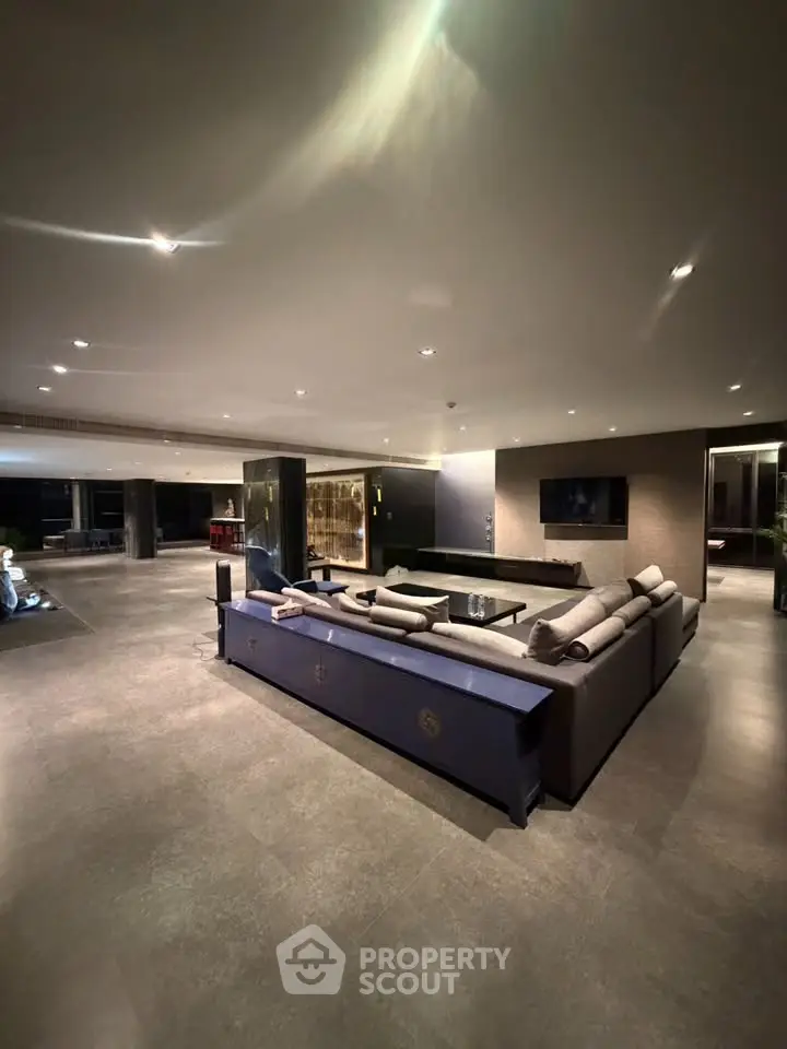Luxurious modern living room with elegant furnishings and ambient lighting