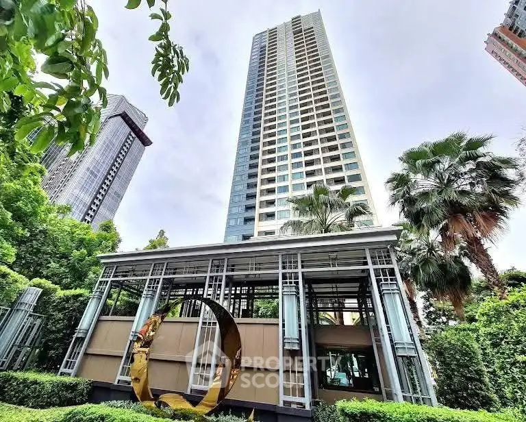Stunning high-rise building with lush greenery and modern architecture in urban setting.
