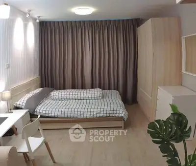 Cozy bedroom with modern decor and ample storage space