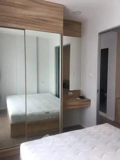 Modern bedroom with mirrored wardrobe and minimalist design