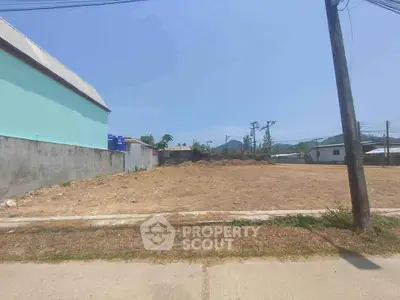 Expansive vacant land ready for development, boasting a clear, leveled lot with potential for residential or commercial use in a growing neighborhood.