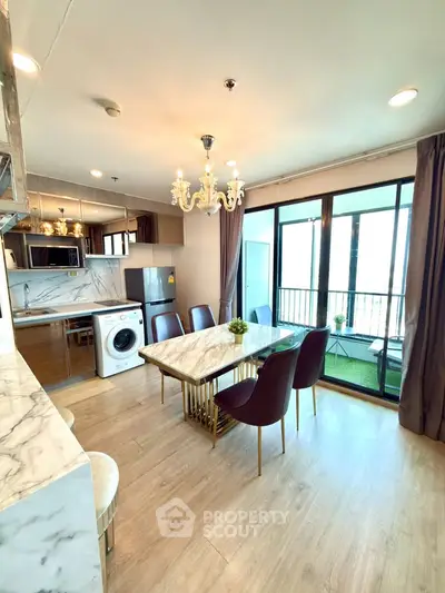 Luxurious open-plan living room with elegant dining area and balcony view