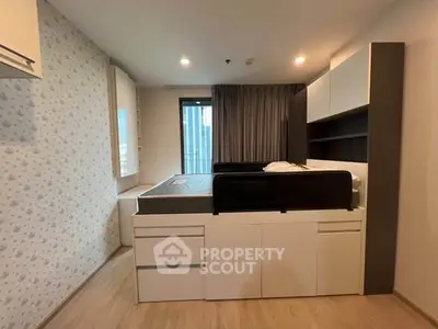 Modern bedroom with stylish storage bed and city view window, perfect for urban living.