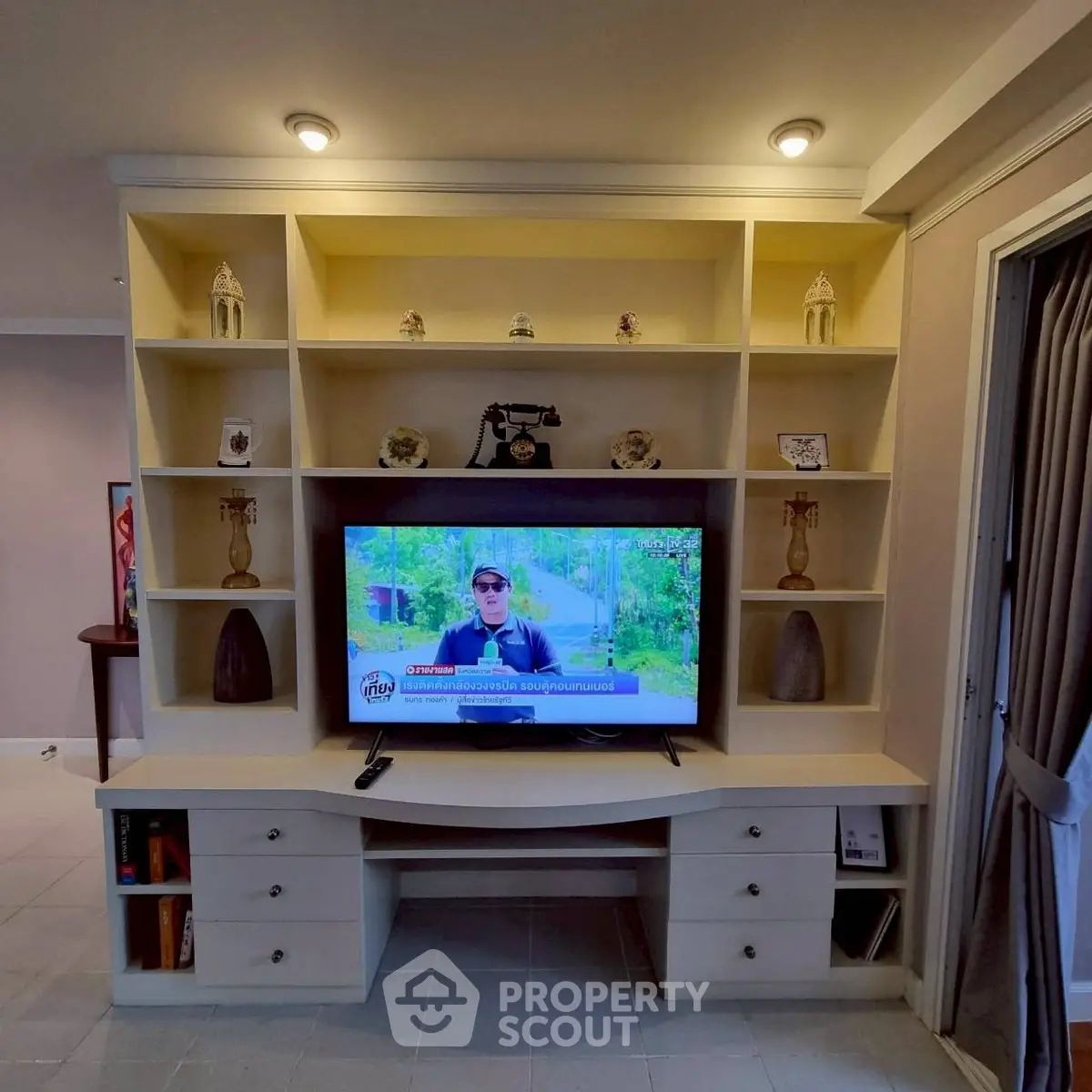 Spacious living room with built-in entertainment center and modern decor