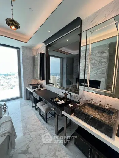 Luxurious marble bathroom with city view and elegant black fixtures.