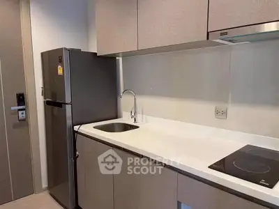 Modern kitchen with sleek cabinetry and stainless steel appliances