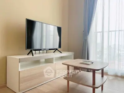 Modern living room with sleek TV stand and large window view