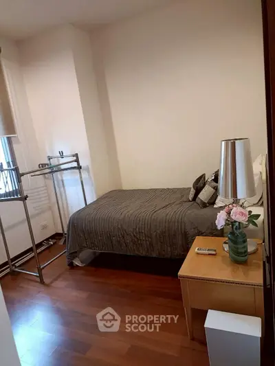 Cozy bedroom with elegant decor and wooden flooring