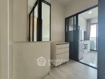 Modern apartment interior with sleek kitchen and ample storage space