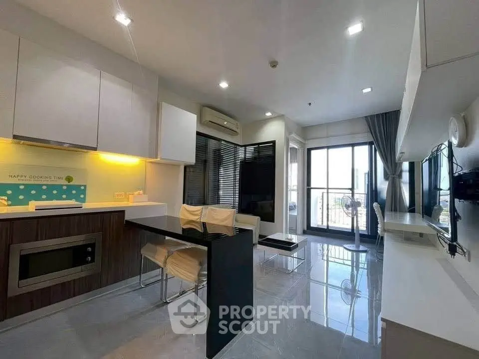 Modern living room with sleek design, open layout, and large windows offering city views.