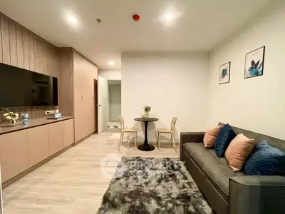 Modern living room with stylish decor and cozy seating area in a contemporary apartment.