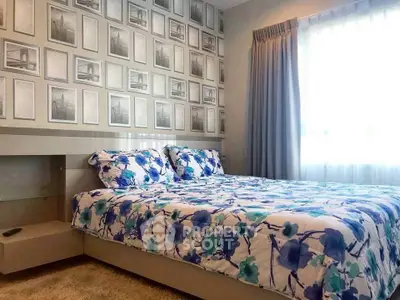 Stylish bedroom with floral bedding and modern decor, featuring a unique accent wall and ample natural light.