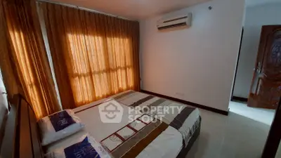 Cozy bedroom with air conditioning and elegant curtains