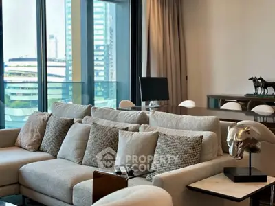 Luxurious modern living room with plush sofa and city view, perfect for urban living.