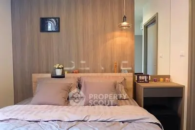 Cozy bedroom with modern decor and warm lighting, perfect for relaxation.