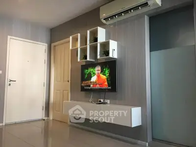 Modern living room with wall-mounted TV and air conditioning unit