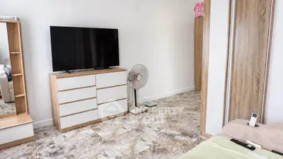 Modern living room with sleek TV stand and stylish flooring