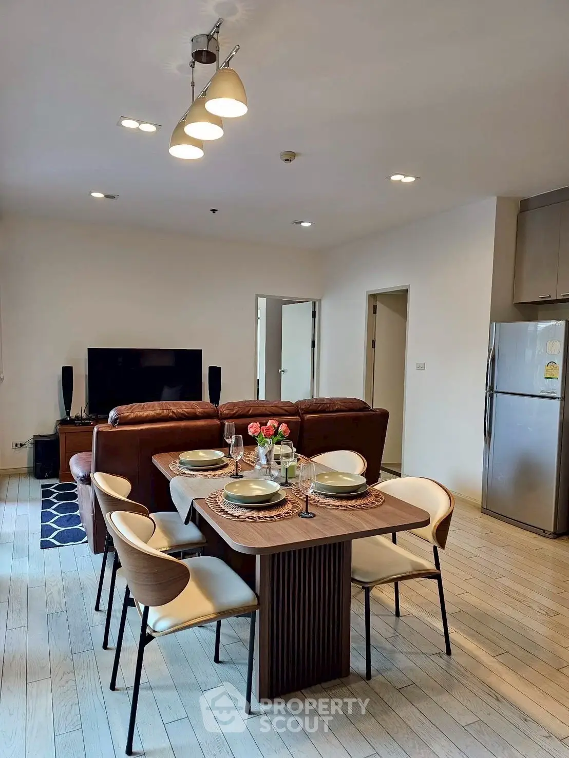 Spacious modern living room with dining area and stylish furniture