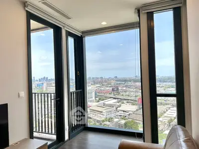 Stunning corner unit with panoramic city views from floor-to-ceiling windows.