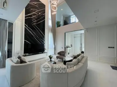 Luxurious modern living room with high ceilings and elegant decor